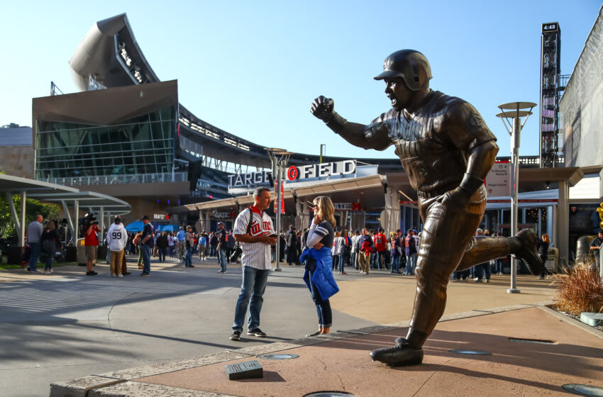 Oct 7, 2019; Minneapolis, MN, USA; Fans stand next to a Kirby Puckett statue before the start of game three of the 2019 ALDS playoff baseball series between the New York Yankees and the Minnesota Twins at Target Field. Mandatory Credit: David Berding-USA TODAY Sports